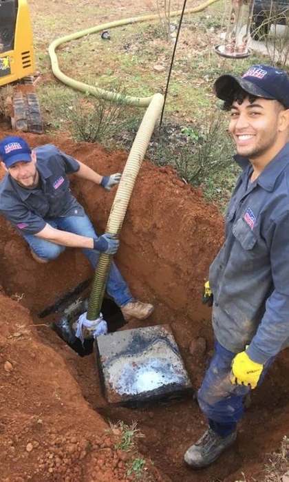 SepticRooter™ licensed technicians performing septic repair in Covington, Newton County